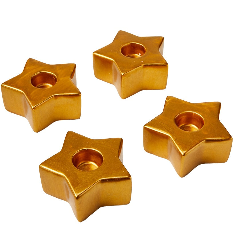 Set of 4 Star-Shaped Gold Taper Candleholders